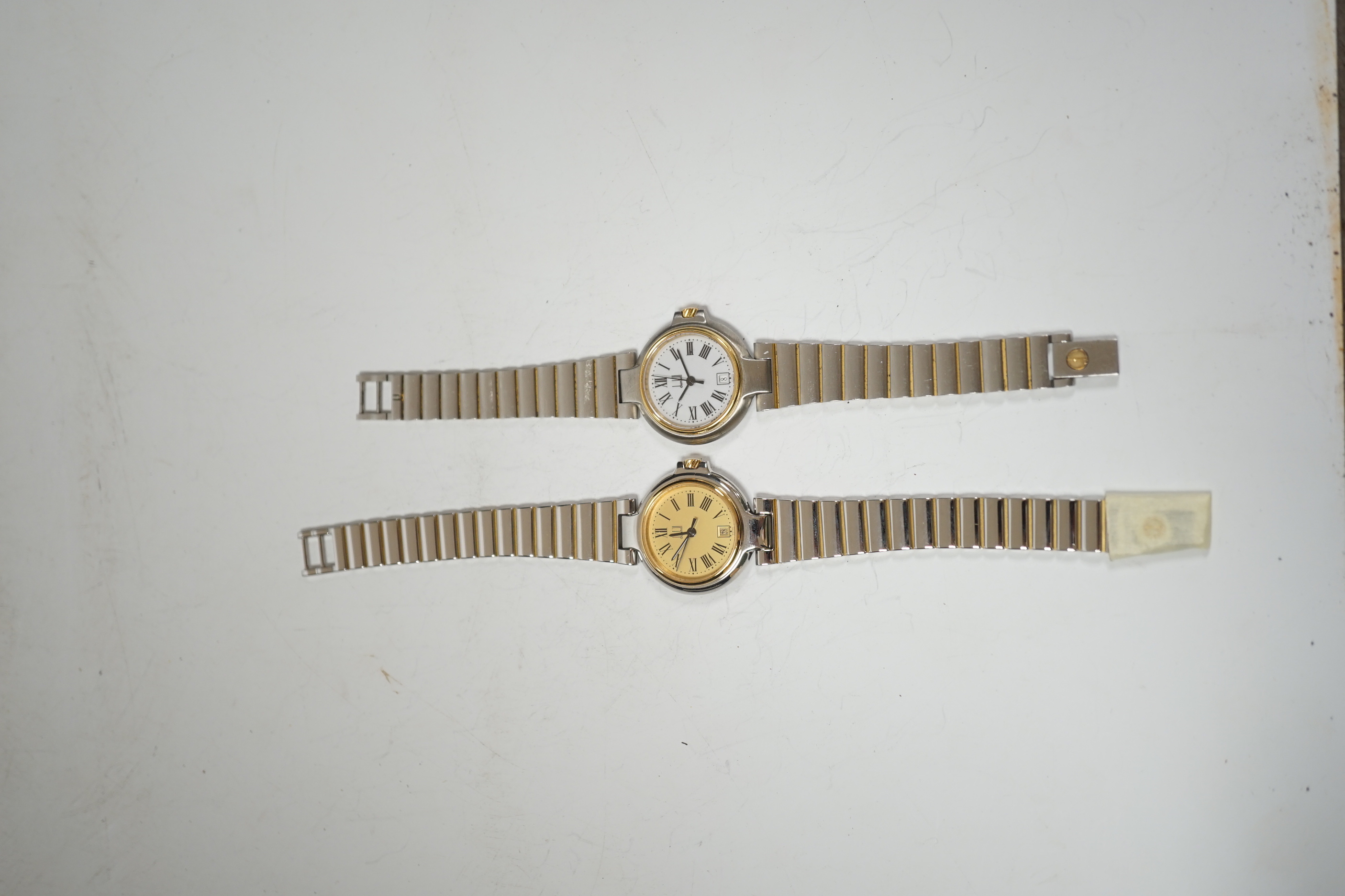 Two lady's steel and gold plated Dunhill quartz wrist watches, one with Dunhill box.